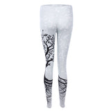 Sports women`s leggings  with a tree print