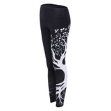 Sports women`s leggings  with a tree print