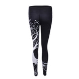 Sports women`s leggings  with a tree print