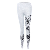 Sports women`s leggings  with a tree print